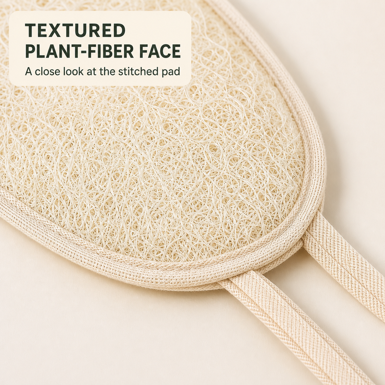 Close-up of natural loofah fibers and stitched edge