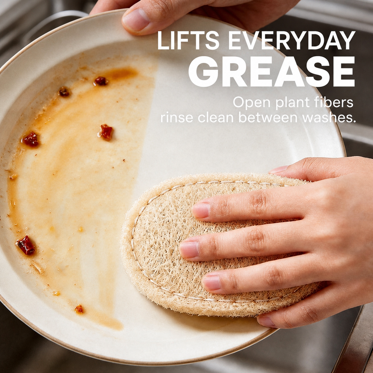 Oval natural loofah scrubber lifting everyday grease from a plate